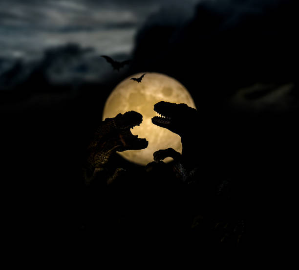 dinosaur with full moon, silhouette on dark night
