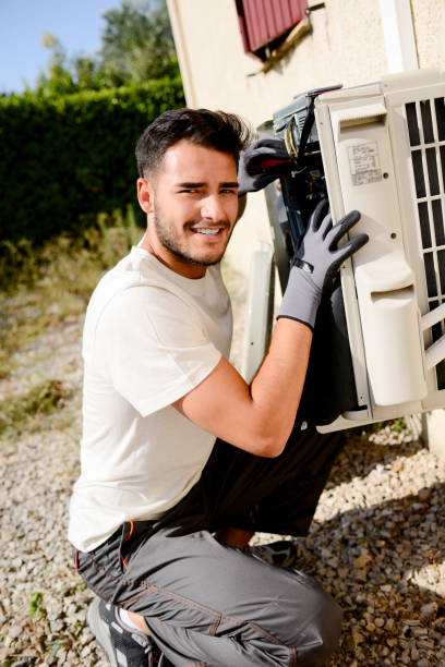 istock young man electrician installer working on outdoor compressor unit air conditioner at a client's home 836252486