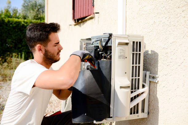 istock young man electrician installer working on outdoor compressor unit air conditioner at a client's home 836252512