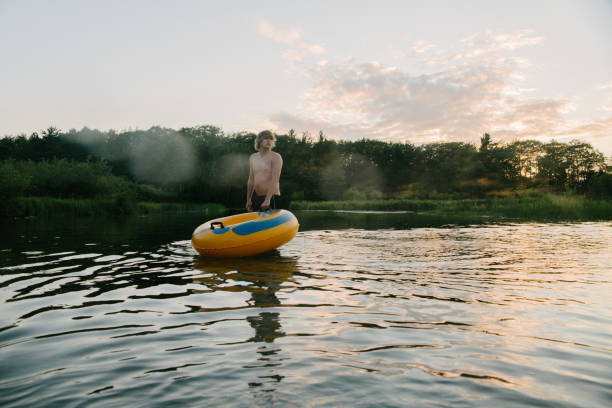 istock Tubing in river 836254860