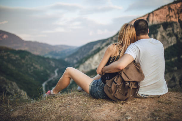 istock Couple Enjoying The View On The Mountain 836258486