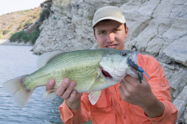 istock Fisherman with bass trophy 836258596