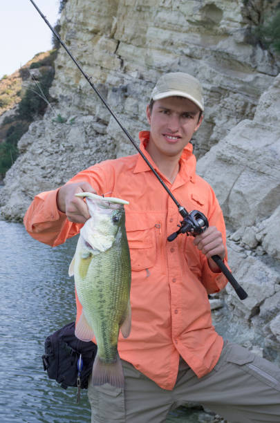 istock Fisherman with bass trophy 836258604