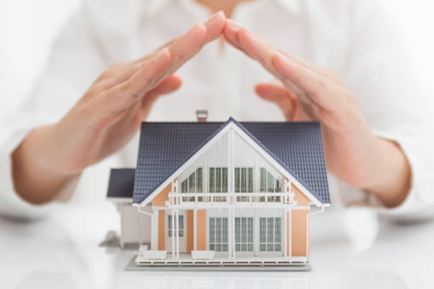 Person forming a house shape using his hand