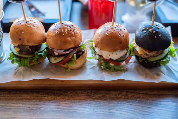 istock Homemade minihamburgers with black buns 836262016