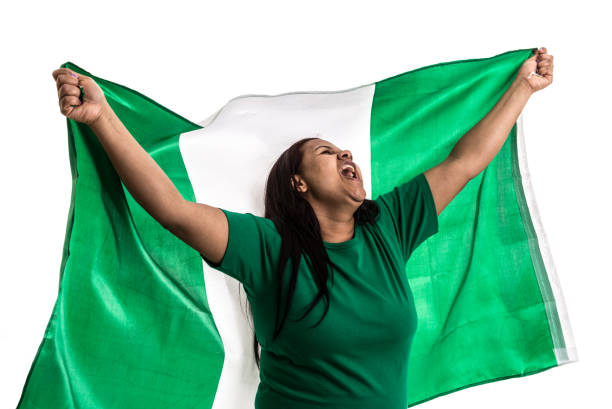 istock Nigerian fan holding the national flag 836265918