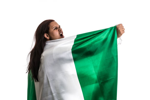 istock Nigerian fan holding the national flag 836265952
