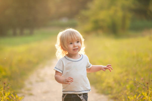 istock Cute little boy walking in a park 836266464