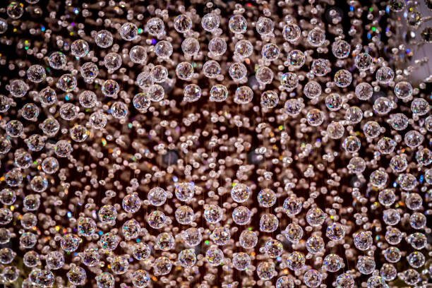 istock Crystal ceiling chandelier crystal glass baubles light illuminate illumination sparkle shiny glass crystal texture background 836269166