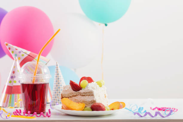 Birthday celebration with cake and colorful balloons