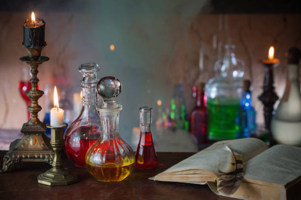 istock Magic potion, ancient books and candles on dark background 836269836