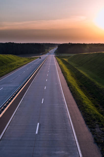 istock Country highway and sunset. Clear road great nature around 836272850