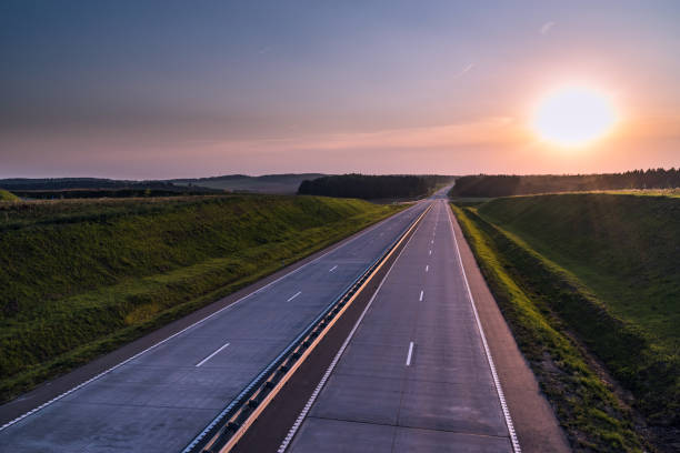 istock Country highway and sunset. Clear road great nature around 836273230