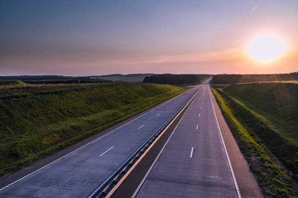 istock Country highway and sunset. Clear road great nature around 836273392