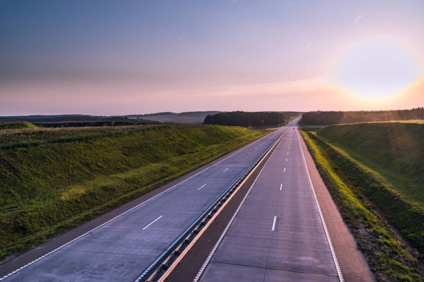 istock Country highway and sunset. Clear road great nature around 836273590