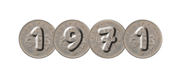 1971 – Five new pence coins on white background