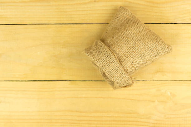 istock Brown sack on brown wooden table, copy space 836286978