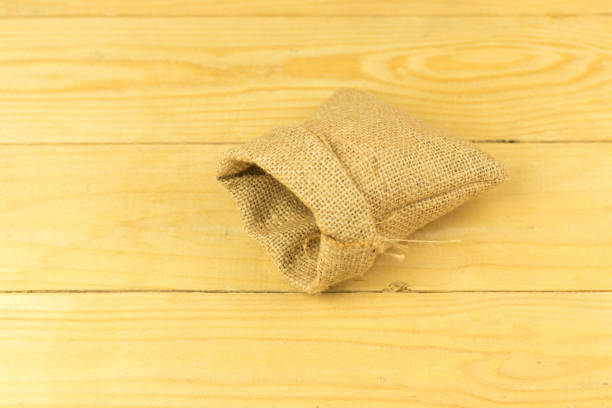 istock sack bag on plank wooden table high angle view 836287050