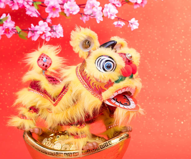 istock chinese traditional dancing lion with ingot 836295610
