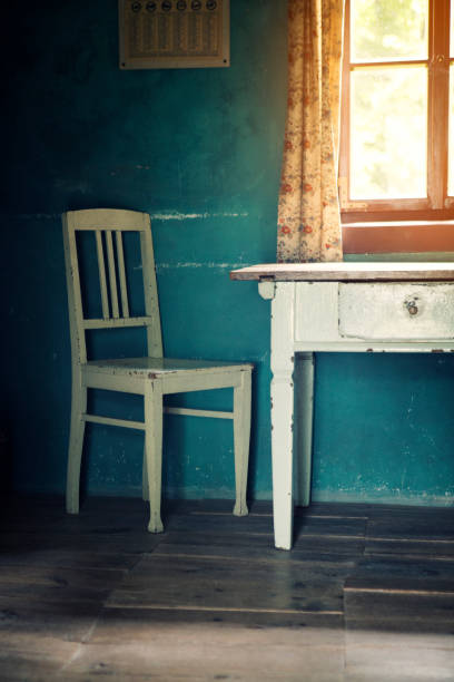 istock room with old vintage chair and table 836295914
