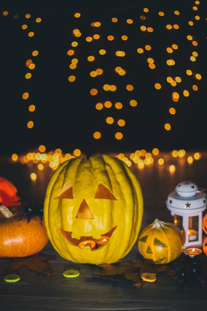 istock Halloween pumpkin head jack lantern on wooden background 836300468