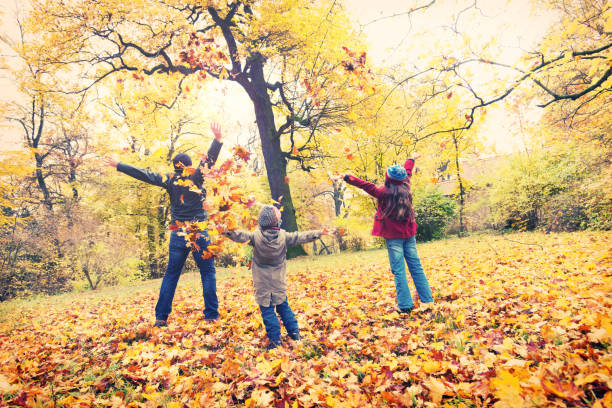 istock Father with his daughters in autumn park 836312078