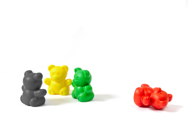 Three plastic bear figures in the colors of the coalition parties stock photo