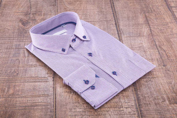 istock Man's shirt folded on a wooden background 836329276