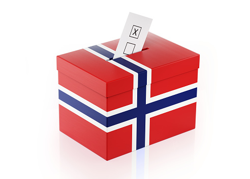 Ballot box textured with Norwegian flag. Isolated on white background. A vote envelope is entering into the ballot box. Horizontal composition with copy space. Great use for referendum and presidential elections related concepts. Clipping path is included.
