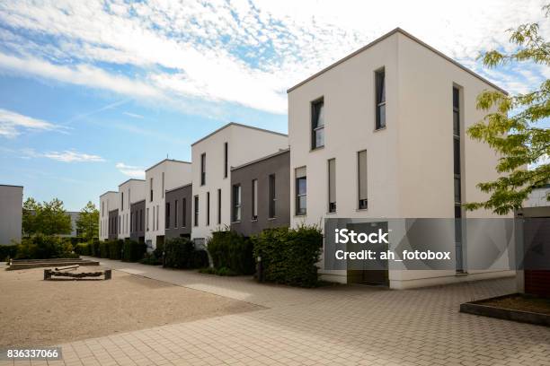 Modern Townhouses In A Residential Area New Apartment Buildings With Green Outdoor Facilities In The City Stock Photo - Download Image Now