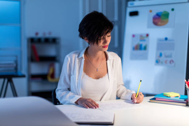 istock Businesswoman working late 836346984