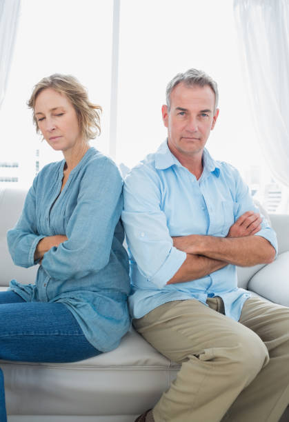 istock Middle aged couple sitting on the sofa not speaking after a dispute 836347564