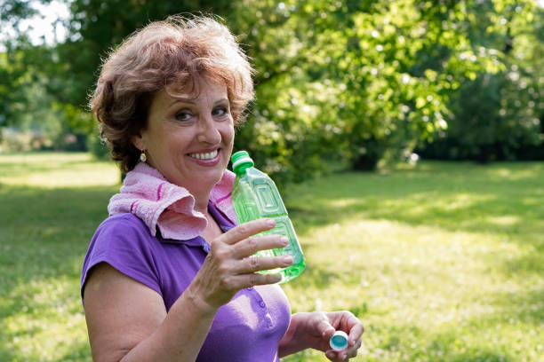 istock Greenery with an active senior woman 836350616