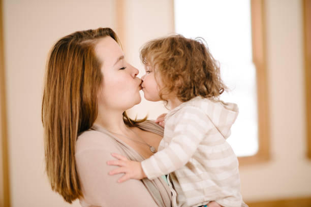istock Aunt kissing niece 836354324
