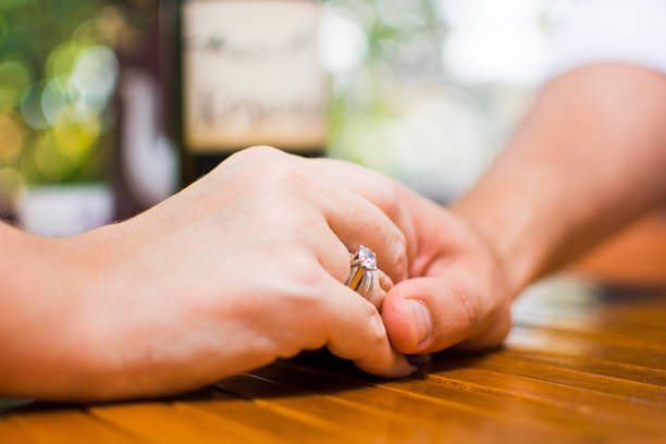 istock Couple holding hands on a date 836357080