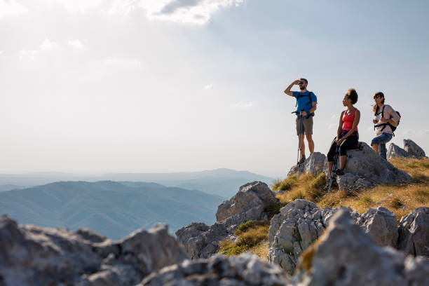 istock hiking friends enjoy the view on mountain peak 836357462