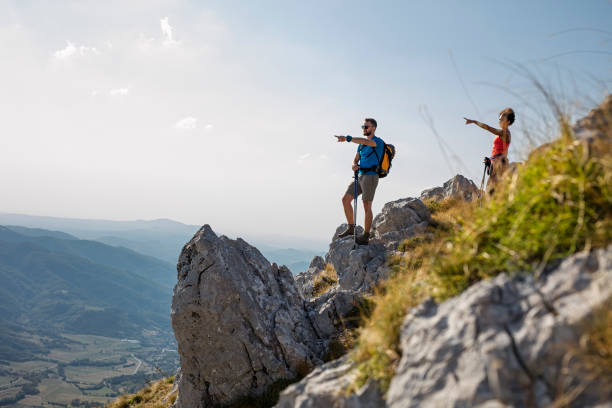 istock hiking friends enjoy the view on mountain peak 836357692