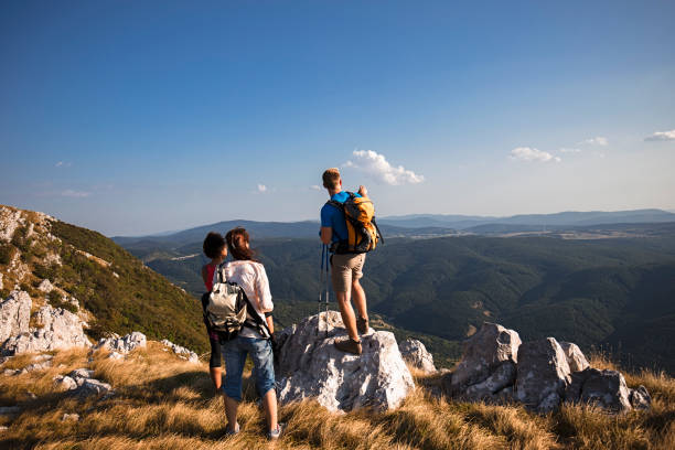 istock hiking friends enjoy the view on mountain peak 836357752
