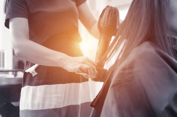 朝のサロンワーク - frizzy human hair hairdresser hair dryer ストックフォトと画像