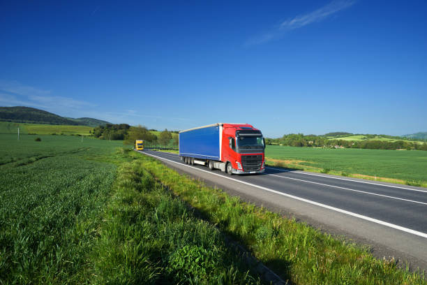 istock Trucks on the asphalt road in a rural landscape 836361428