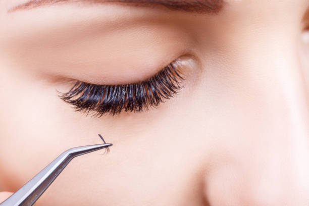 istock Eyelash Extension Procedure. Woman Eye with Long Eyelashes. Lashes, close up, macro, selective focus 836364938