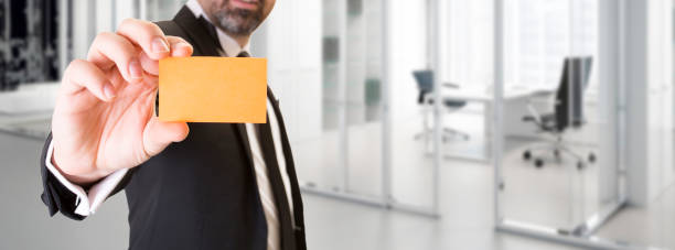 istock businessman showing business card 836368620