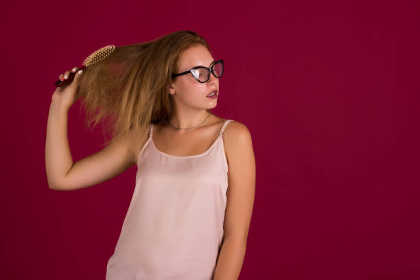 istock Young cute girl with comb, studio 836369322