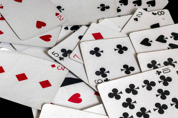 istock Spread playing cards deck, on a black reflective background, showing face, numbers and suits 836376166