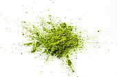 Matcha powder explosion on white background top view.
