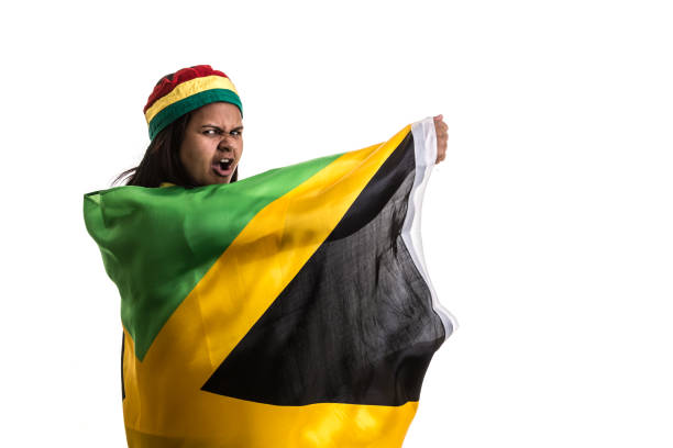 istock Jamaican fan holding the national flag 836386830