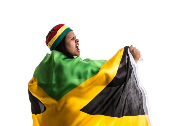 istock Jamaican fan holding the national flag 836386844