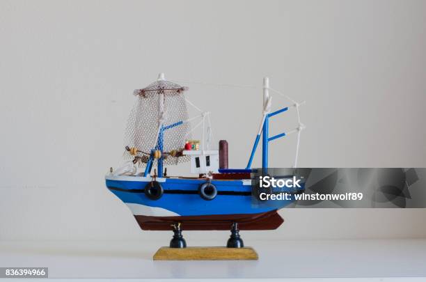Toy Fishing Boat With White Background Stock Photo - Download