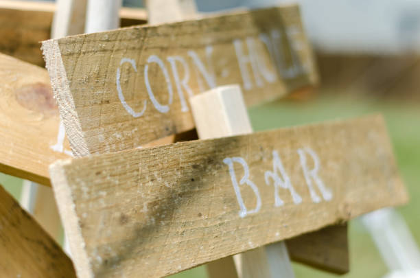 istock Corn hole and bar wooden sign at wedding 836395128