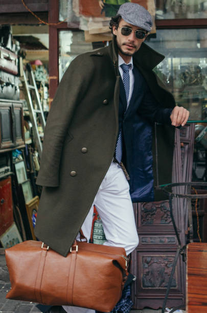istock Gentleman holding a leather bag 836395486